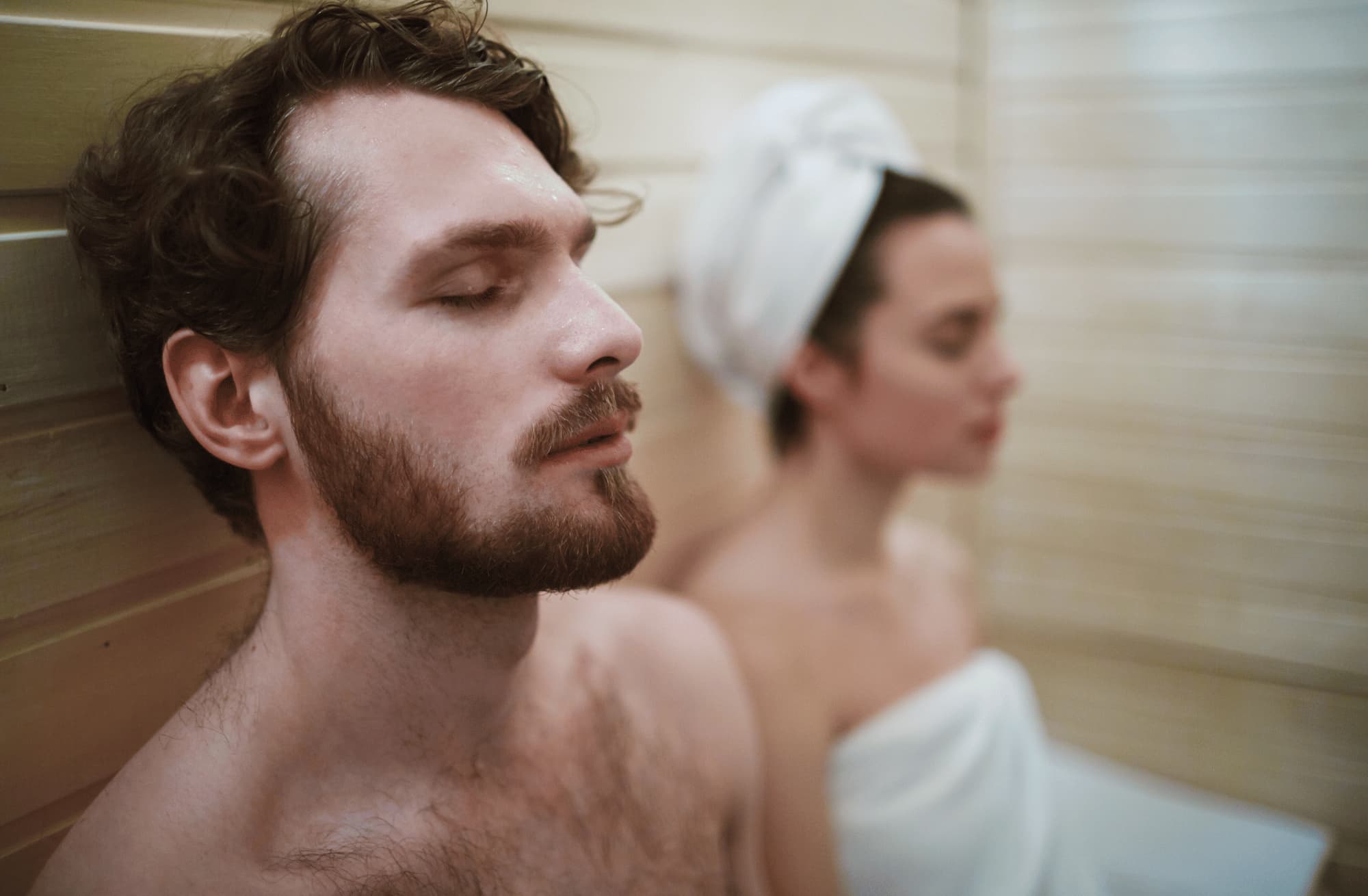 Man and woman resting in a sauna