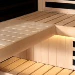 A close up of inside the saeting area of a Tylo Kiruna Hybrid sauna, showcasing the light feature