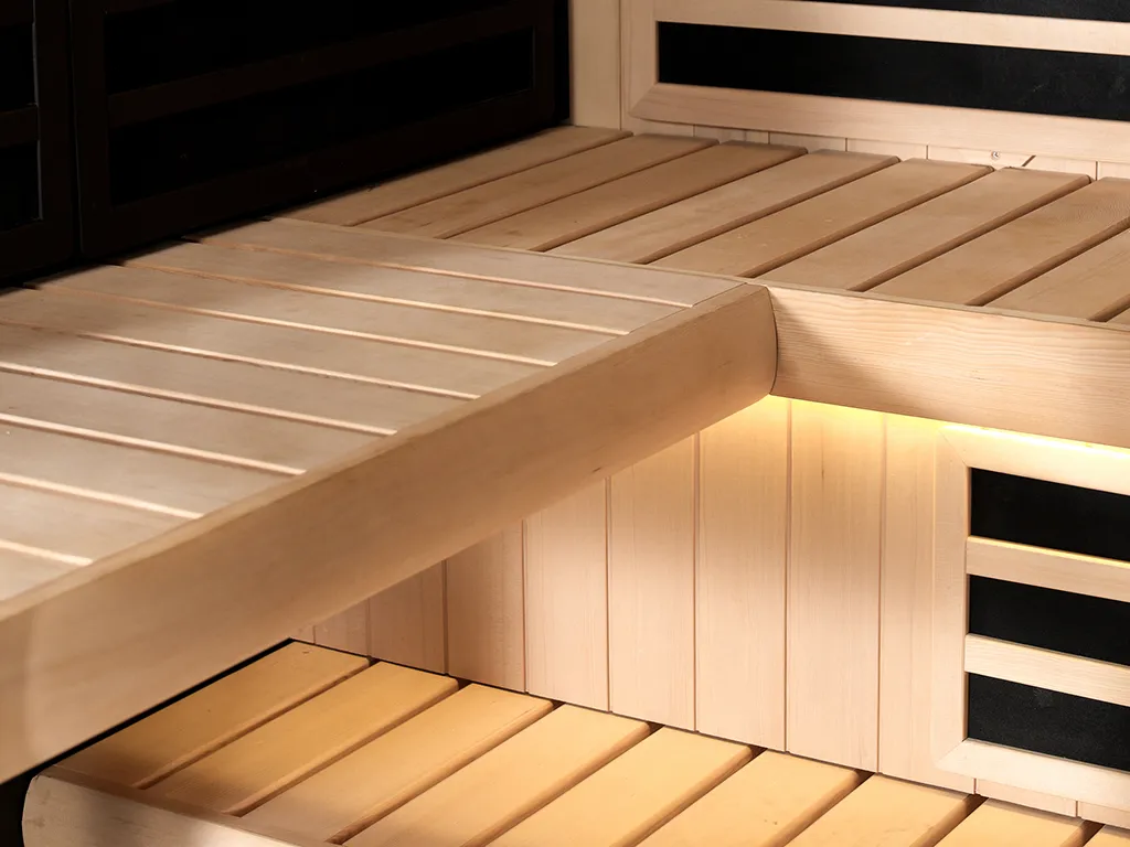 A close up of inside the saeting area of a Tylo Kiruna Hybrid sauna, showcasing the light feature
