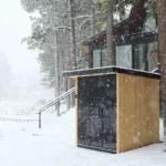 A tylo Lulea outdoor sauna sitting outside in the snow