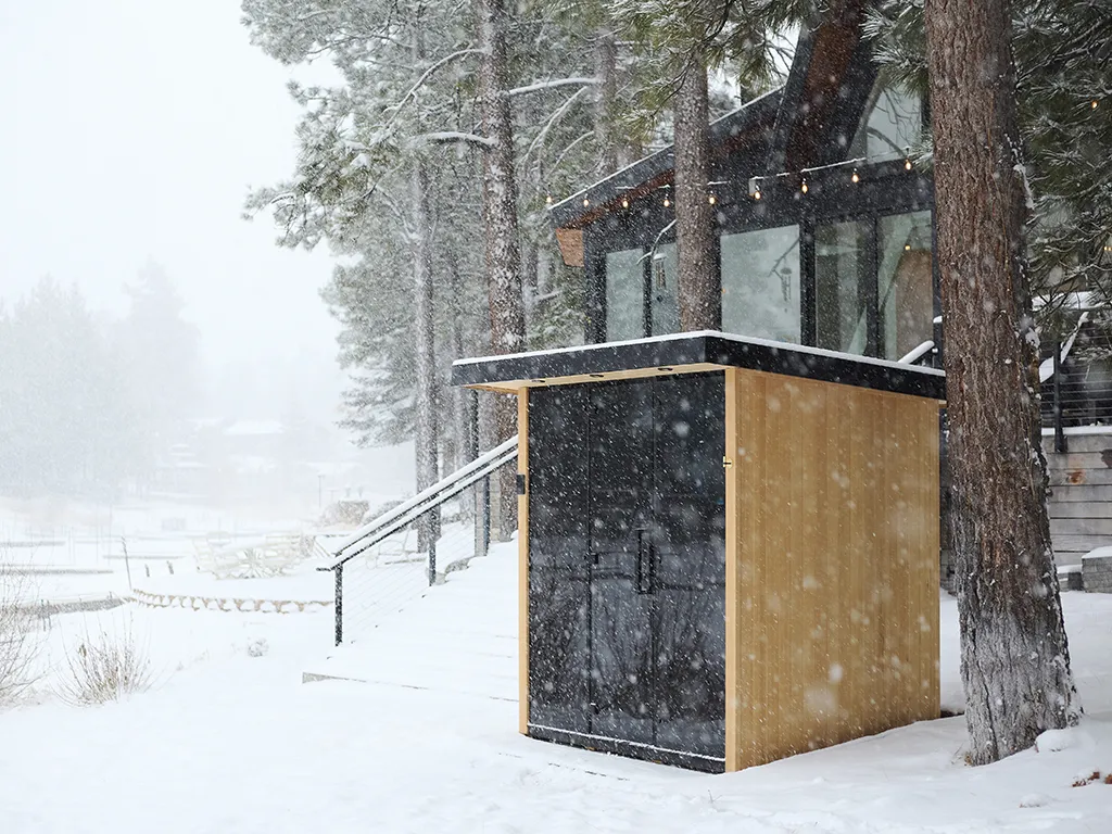 A tylo Lulea outdoor sauna sitting outside in the snow